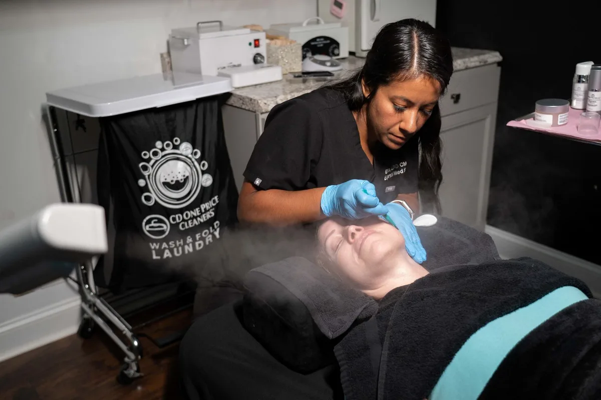 Medical aesthetician performing sterile dermaplaning exfoliation