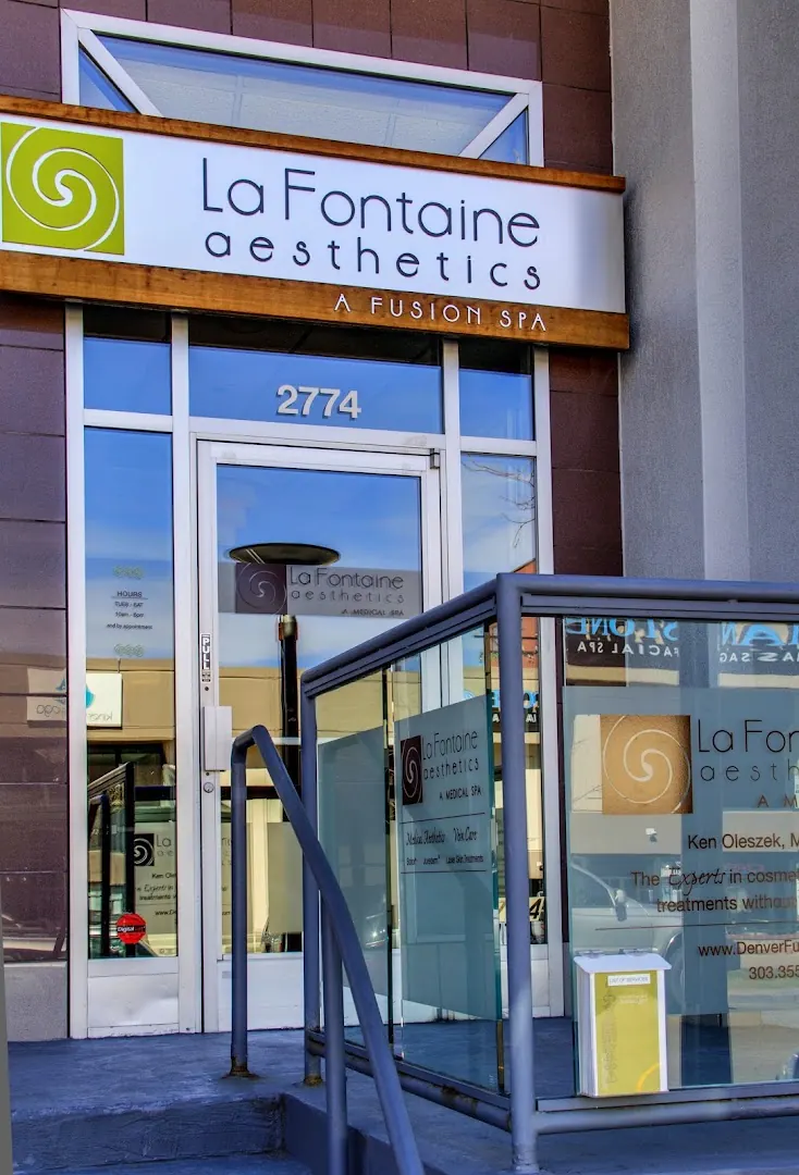 La Fontaine Aesthetics sign above a glass entrance numbered 2774 with frosted railing panels