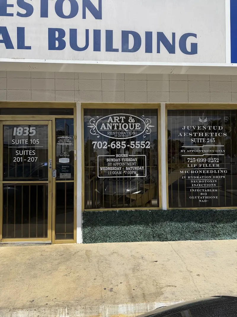Building frontage with Juventud Aesthetics Suite 245 window sign beside the 1835 entry door