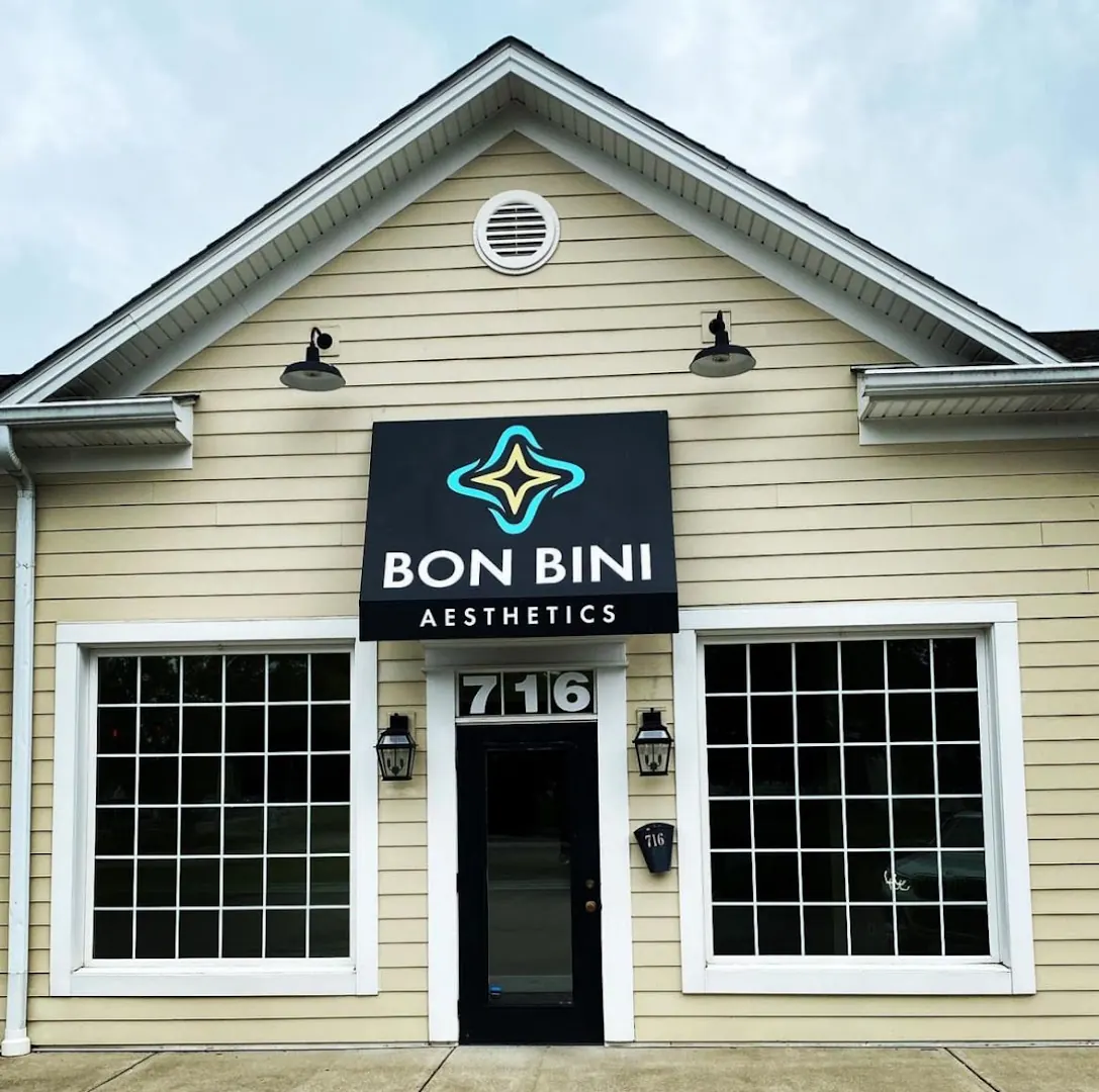 Bon Bini Aesthetics awning above a black door numbered 716 on a clapboard building