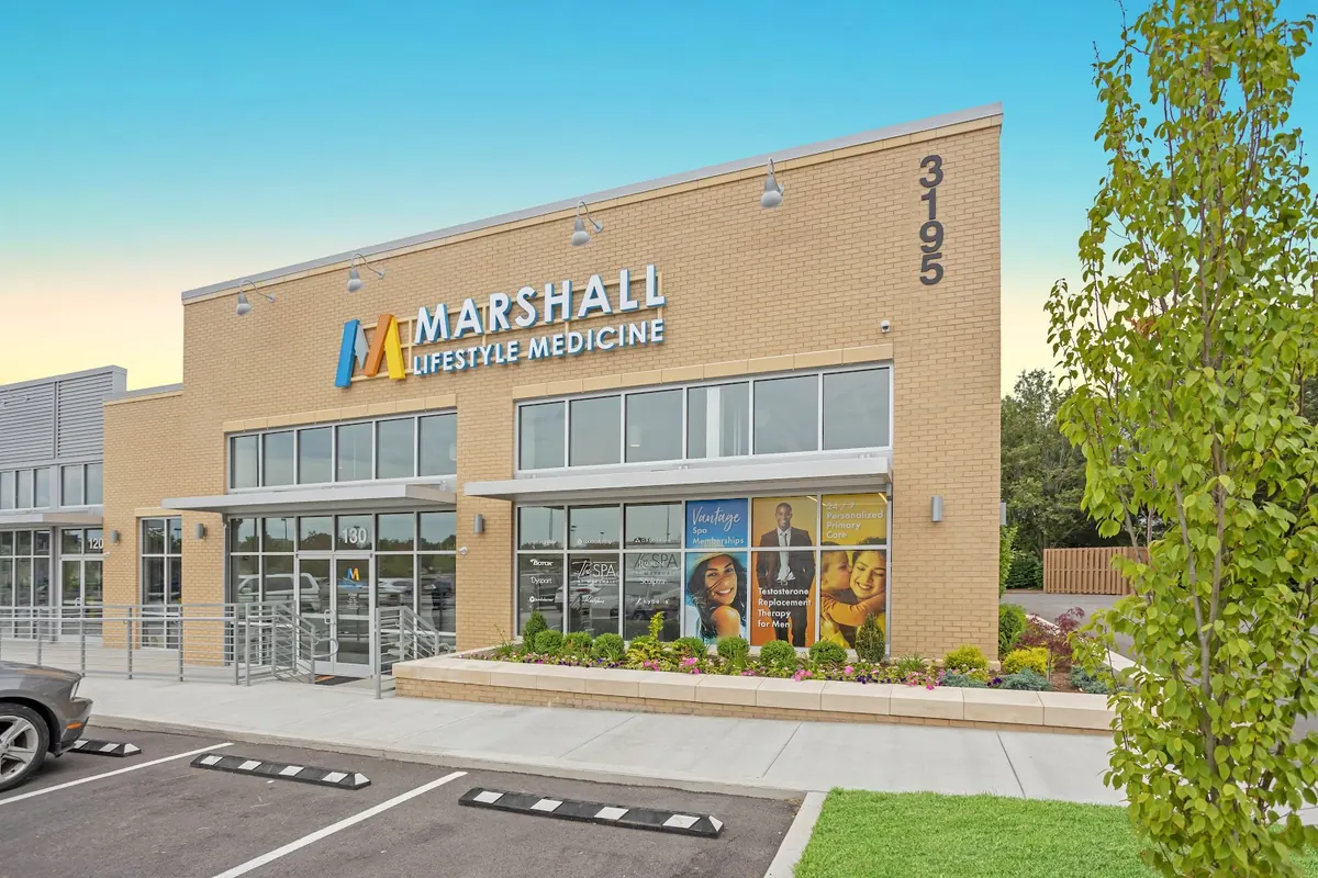 Marshall Lifestyle Medicine brick building with 3195 numerals and The Spa at Marshall window decals