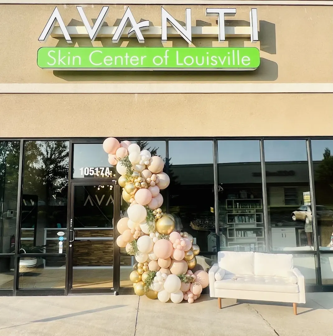 Avanti Skin Center of Louisville storefront with a balloon arch and white loveseat