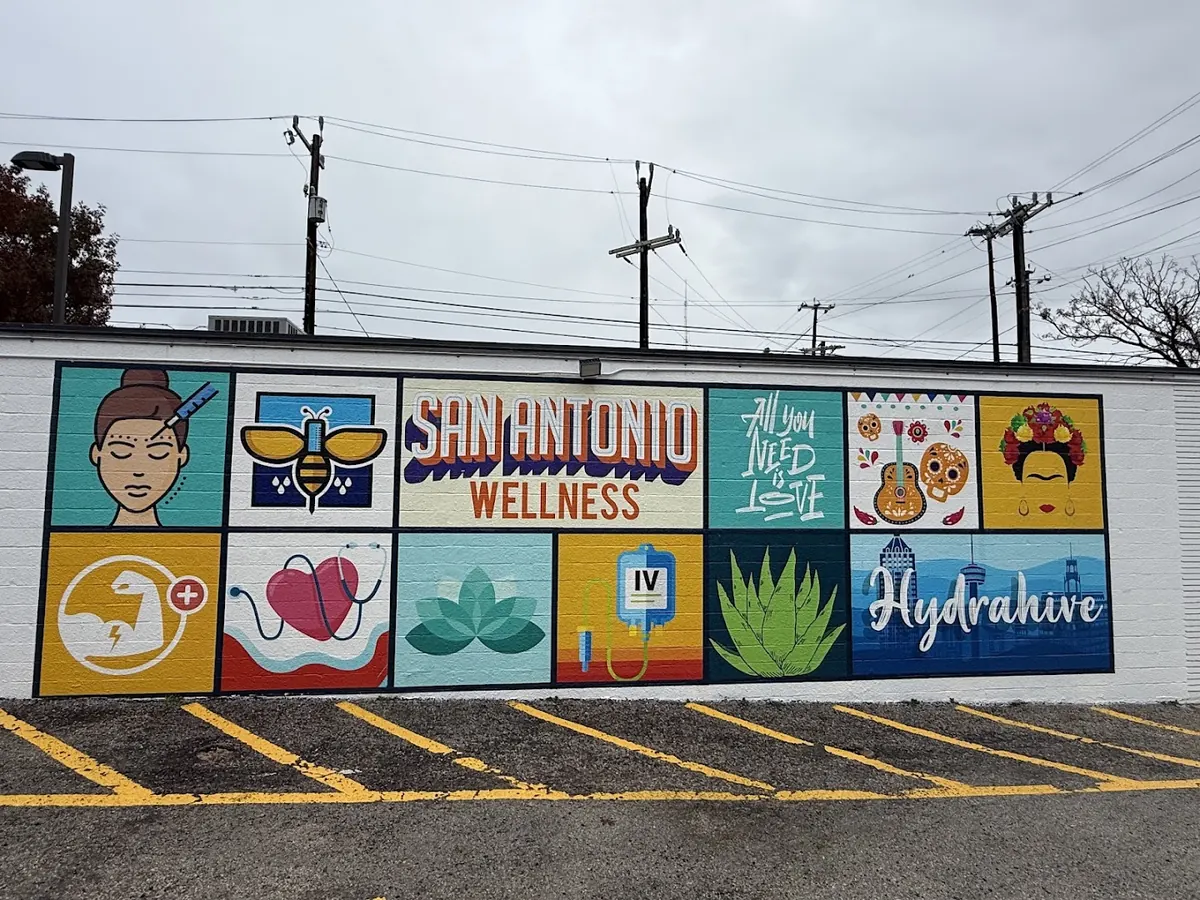 Painted wall mural of wellness icons with San Antonio Wellness and Hydrahive lettering