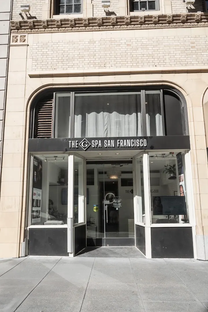 Arched storefront with The G Spa San Francisco sign above a glass entrance door